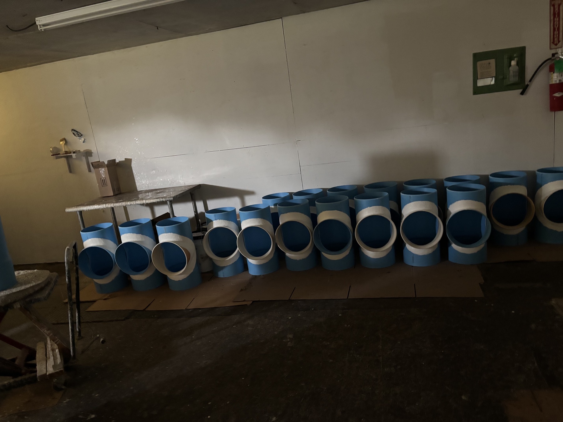 Rows of custom PVC fittings fabricated by Agri Plastics